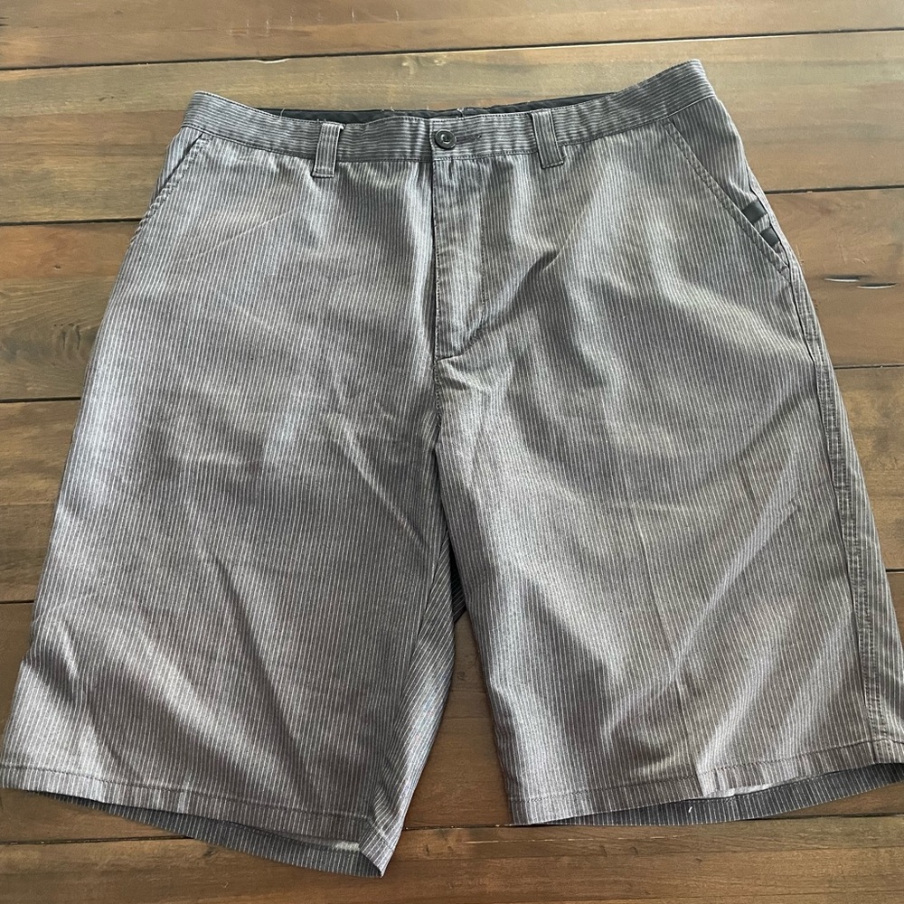 Travis Mathew pinstripe shorts.